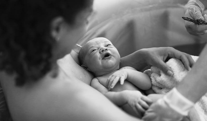 Photo of a mother holding a newborn baby