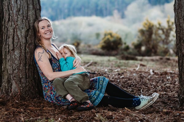 Woman breastfeeding toddler