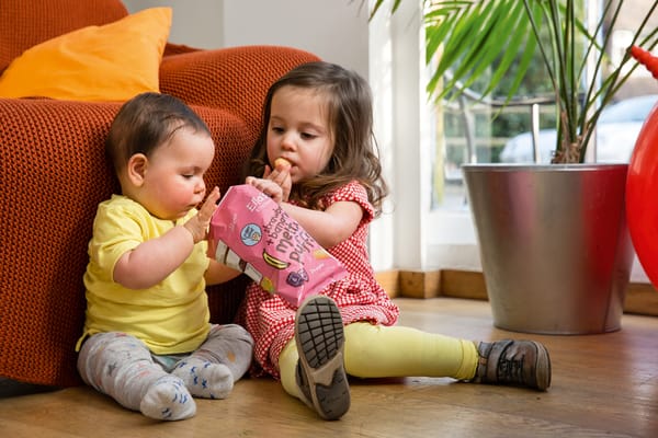 two children eating organic snacks